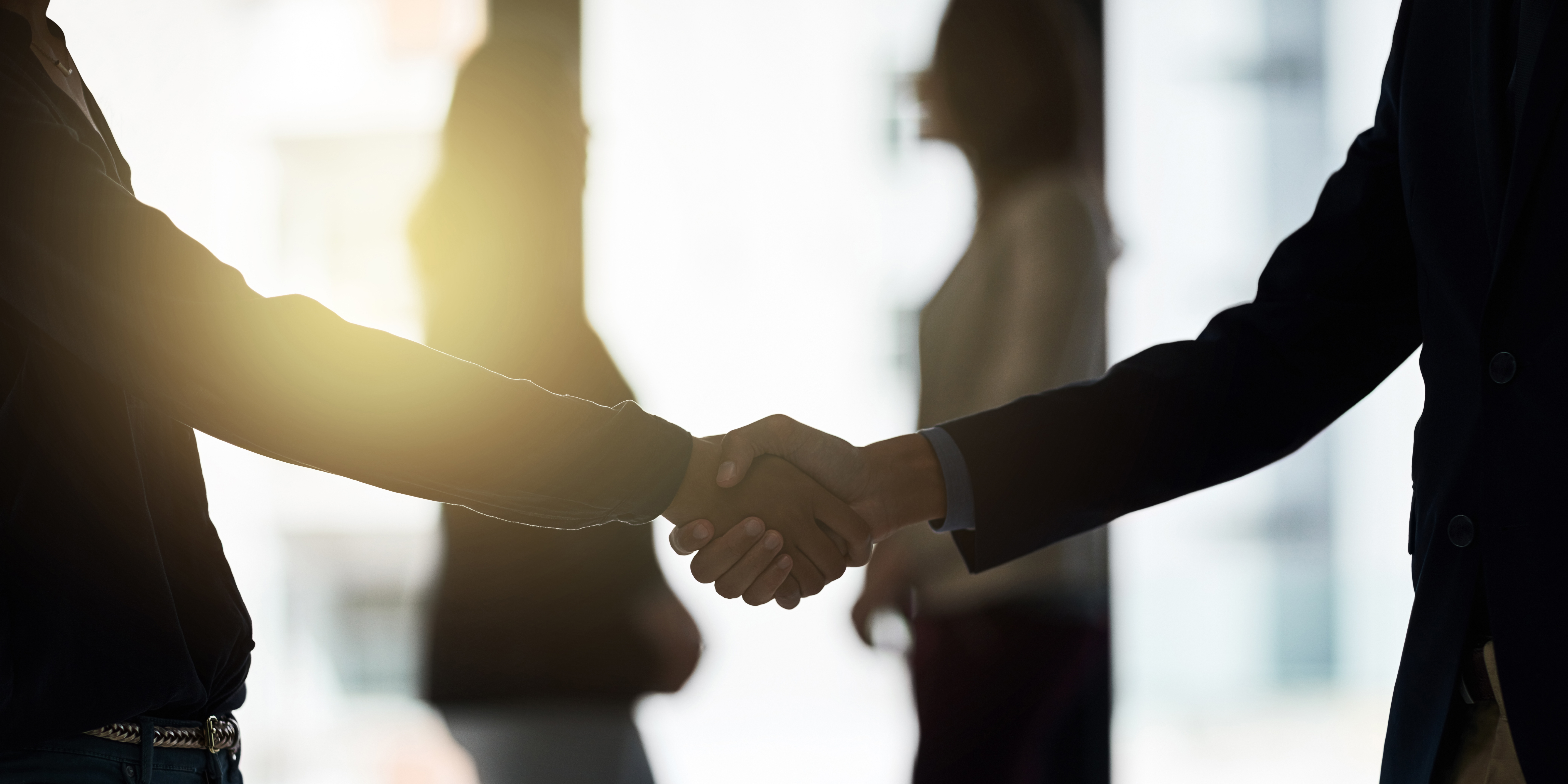 three men and laughing two women walking side by side